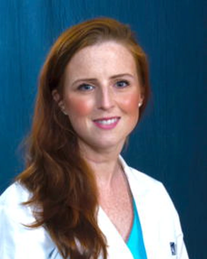 Professional portrait of Ann Igoe, MD in a white coat